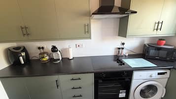 Coffee/tea maker, fridge, microwave, oven