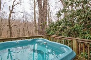 A hot tub on a wooden deck surrounded by trees. - Appalachian Retreat (Blowing Rock)