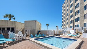 A rooftop pool area with lounge chairs and a small pool. - Top of the Gulf 816 (Panama City Beach)