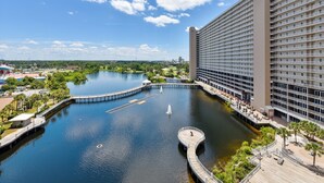 A large hotel with a waterfront view, a dock, and a fountain. - Laketown Wharf 835 (Panama City Beach)