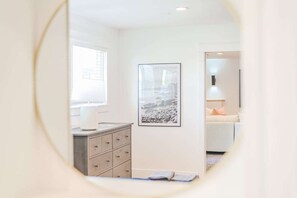 A room with a bed, a dresser, a framed picture on the wall, and a window with blinds. - 72 S Orem Entire Home (Orem)