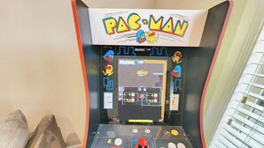 A Pac-Man arcade machine with a control panel, game screen, and score display. - 6486 Lakeside #15 (Huntsville)
