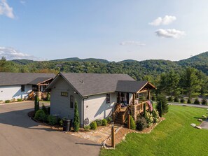 A two-story lodge with a porch and a view of a mountainous landscape. - Valley View (Banner Elk)