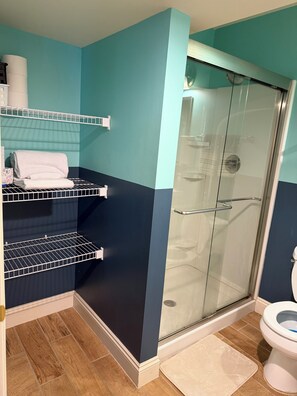 Shower, towels, soap, toilet paper