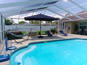 Outdoor pool, a heated pool - "Villa Twin Waters Waterfront Heated Pool Home with Gym & Kayaks" (Lake Placid)