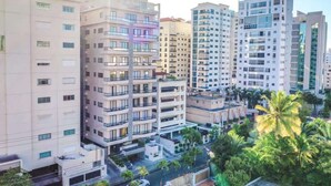 A high-rise residential building with multiple balconies and a modern architectural design. - Regatta Living Ii with Breakfast Included! - 905 (Santo Domingo)