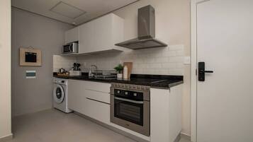 Coffee/tea maker, fridge, microwave, oven