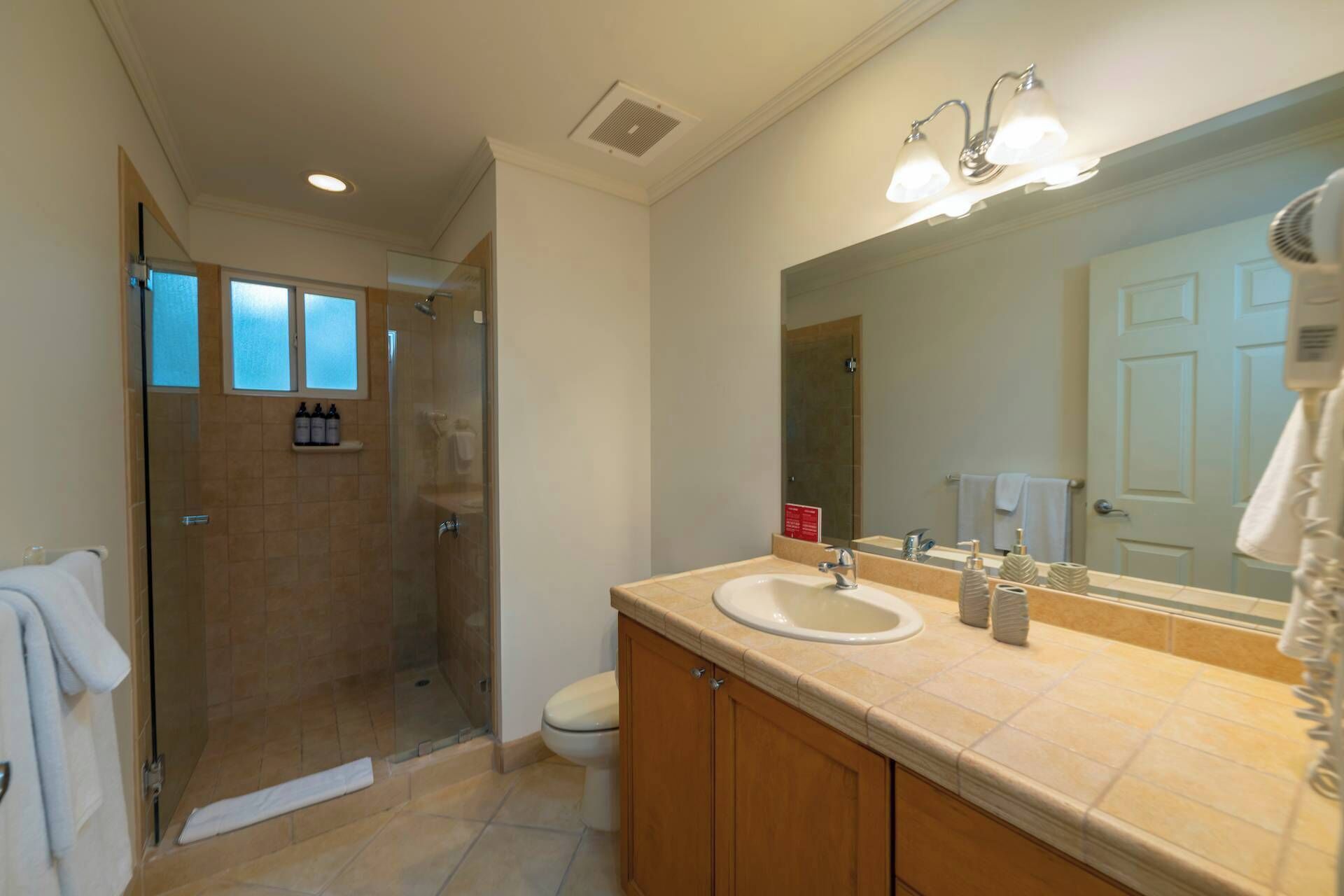 Shower, hair dryer, towels, shampoo