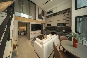 A modern interior with a living area, kitchen, and dining space. - Cozy 2br Close to Panama Old Town (Panamá)