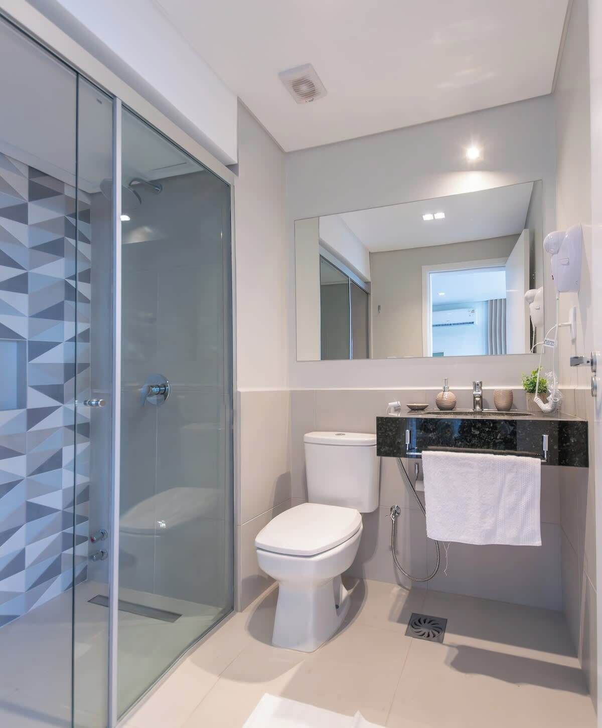 Shower, hair dryer, towels, shampoo