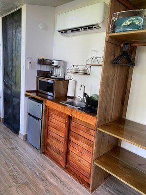 Coffee/tea maker, fridge, microwave, cookware/dishes/utensils