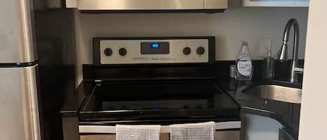 Coffee/tea maker, fridge, microwave, oven