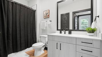 Shower, towels, soap, toilet paper
