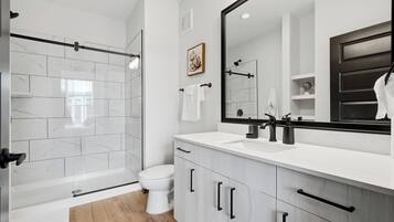 Shower, towels, soap, toilet paper