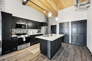 Coffee/tea maker, fridge, microwave, dishwasher - Downtown Fargo Brick Loft · 1BR/1BA · Steps to Dining, Near NDSU (Fargo)