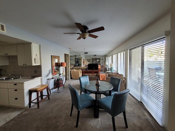 Living area - Ground level condo with a large enclosed patio, steps from the pool (Palm Springs)