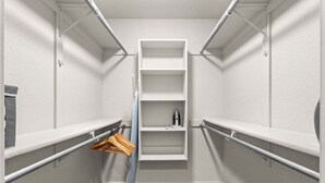 A walk-in closet with white shelving units and a hanging rod. - Casa Joya @ Jenks Spain Ranch/Five Oaks (Jenks)