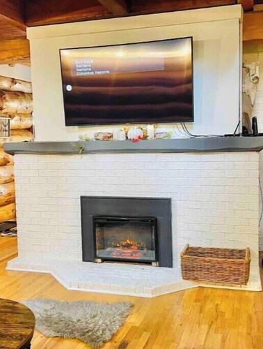 Cozy Log Cabin with wrap around pouch, take in beautiful views from all angles.