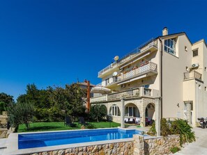 A multi-story building with a swimming pool, balconies, and a stone facade. - TIJANA 2 / HR-07197-02 by Interhome (Novi Vinodolski)