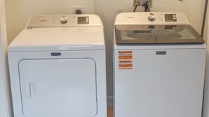 Two Maytag washing machines side by side in a laundry room. - Northport Nest- Newly Renovated Modern Farmhouse (Northport)