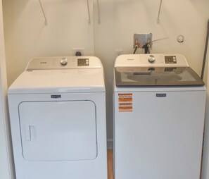 Two Maytag washing machines side by side in a laundry room. - Northport Nest- Newly Renovated Modern Farmhouse (Northport)