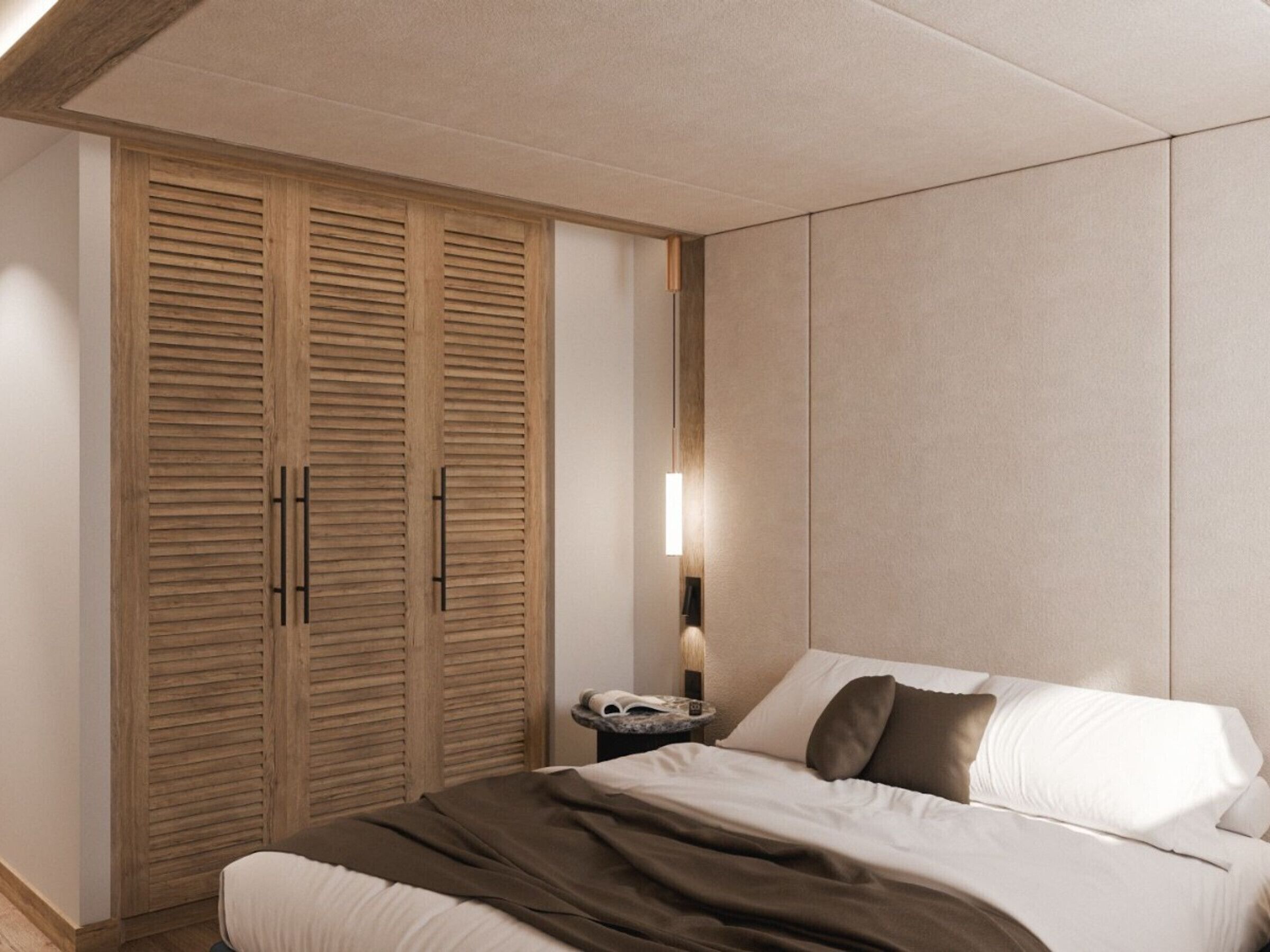 Un dormitorio con cama, mesita de noche, lámpara y armario de madera.