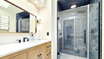 Shower, hair dryer, towels, soap