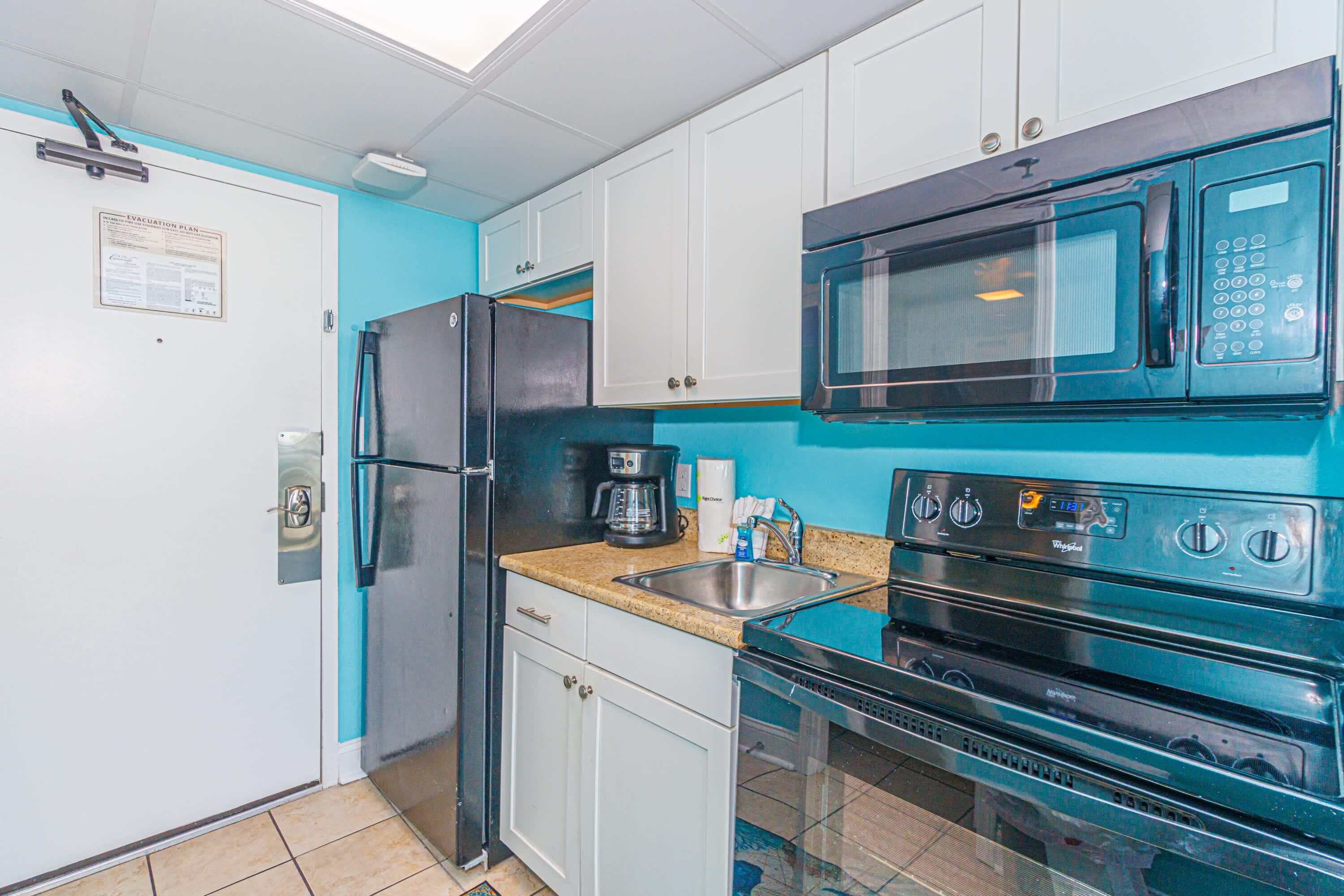 Coffee/tea maker, fridge, microwave, oven