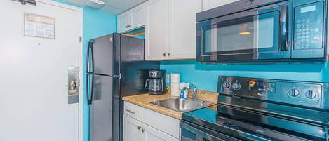 Coffee/tea maker, fridge, microwave, oven