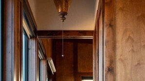 A wooden hallway with a large potted cactus. - The Moki House (with hot tub) (Wayne County)