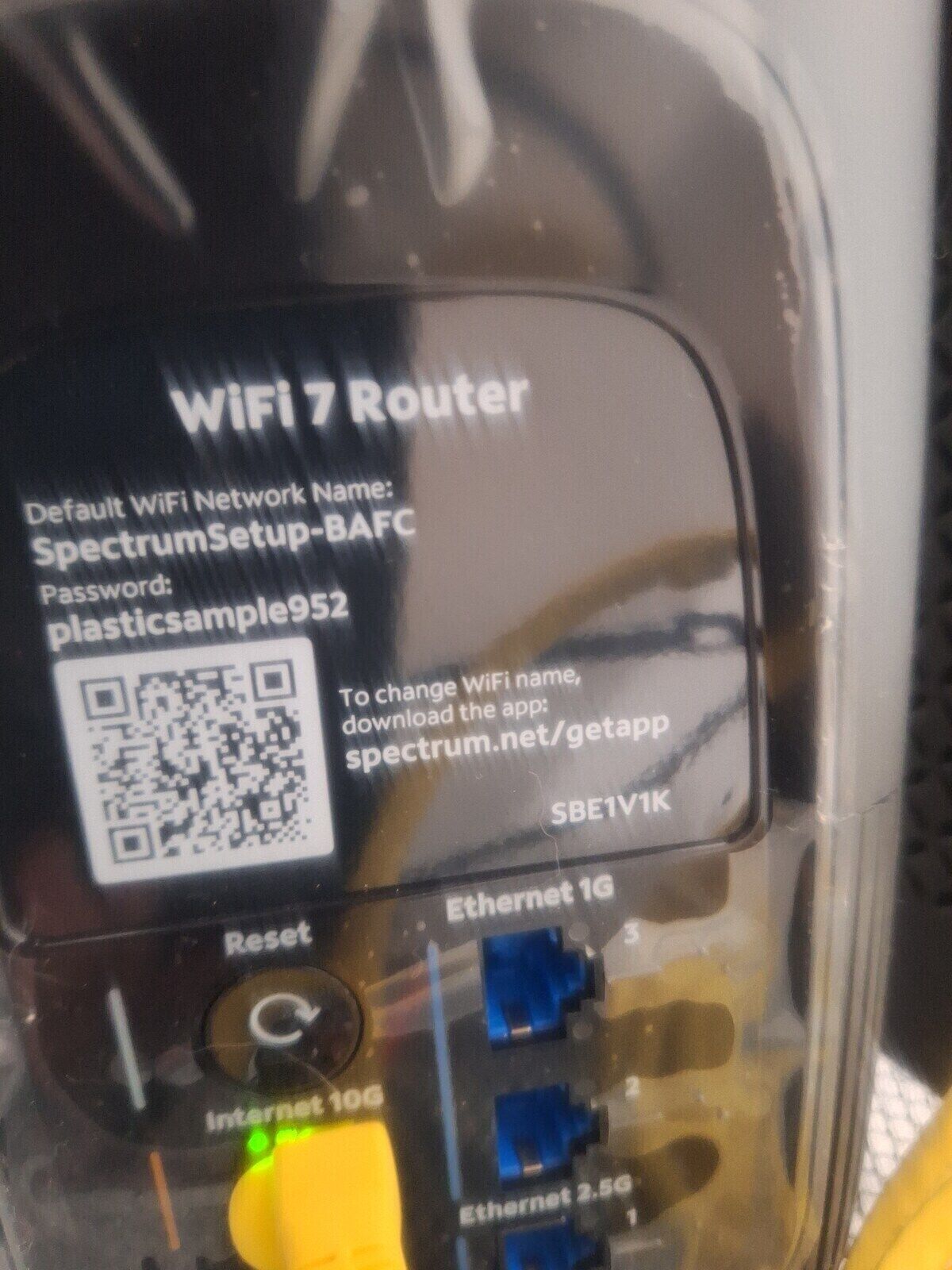 A WIFI 7 Router with a QR code and instructions for changing WiFi name.