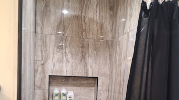 Shower, hair dryer, towels, toilet paper