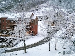 A snow-covered building with multiple windows and a visible balcony. - Les Chalets d'Ax by Interhome (Ax-Les-Thermes)