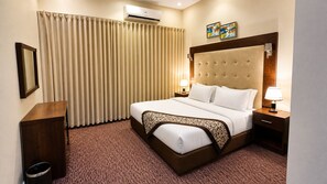 Cubrecamas, minibar, cortinas blackout y sistema de insonorización 