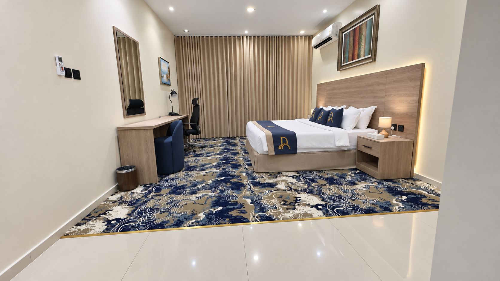 A modern hotel room with a bed, bedside tables, a desk, and a chair.