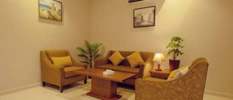 Comfort Apartment | Living area | 50-inch Smart TV with satellite channels, streaming services