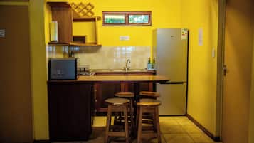 Family Apartment, Patio, Pool View | Private kitchen | Full-size fridge, microwave, stovetop, cookware/dishes/utensils