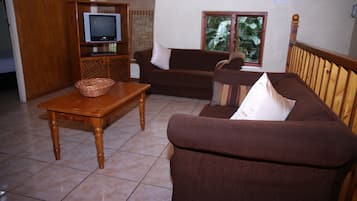 Family Apartment, Patio, Pool View | Living area