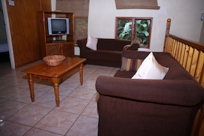 Family Apartment, Patio, Pool View | Living area