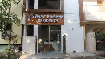 A residential building with a sign reading 'Swamy Ramana Residency.'