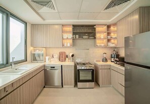 Coffee/tea maker, fridge, microwave, oven - Waterfront Ajmal Makan Villa w/ Private Pool (Al Hamriyah)