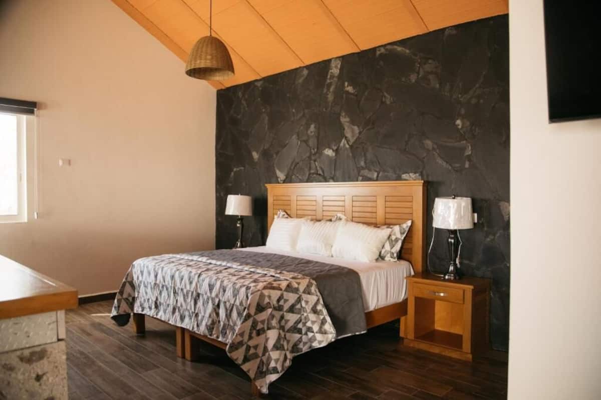 Deluxe Suite, Balcony, Garden View | In-room safe, iron/ironing board, WiFi (free)