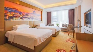 A hotel room with two beds, a desk, a chair, a TV, and a large window. - Vienna International Hotel (Leshan Shizhong District Store) (Leshan)