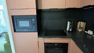 Coffee/tea maker, oven, toaster, cookware/dishes/utensils