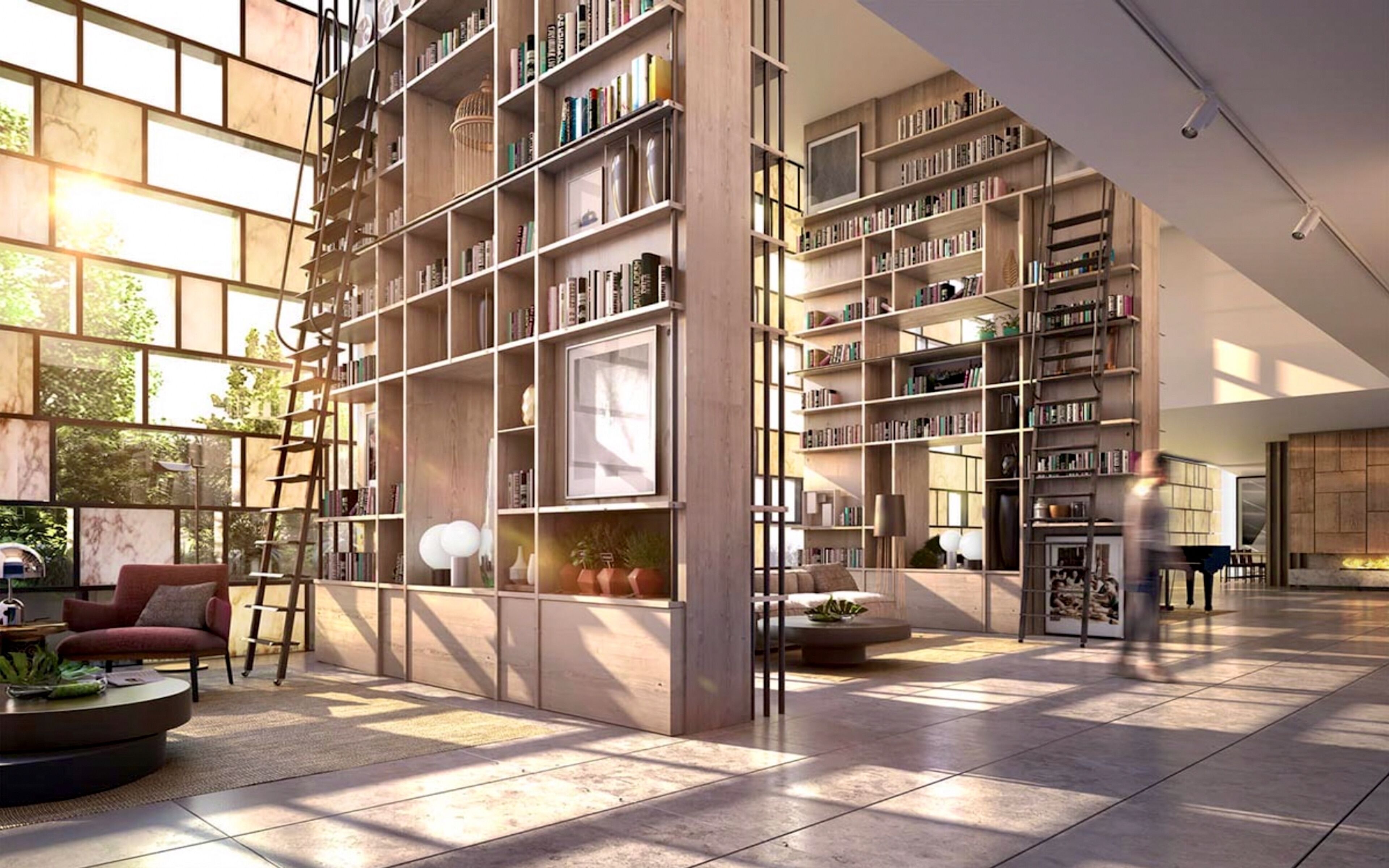 Eine geräumige Bibliothek mit hohen Decken und großen Fenstern, inklusive Bücherregalen und einer gemütlichen Sitzecke.