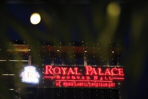 A neon sign for 'ROYAL PALACE' with 'BANQUET HALL' and 'AC ROOM | HOTEL | RESTAURANT' text. - HOTEL ROYAL PALACE (Bhiwani)