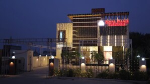 A hotel with a prominent sign reading 'ROYAL PALACE' and a visible entrance gate. - HOTEL ROYAL PALACE (Bhiwani)
