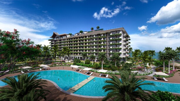 A hotel with multiple balconies, a swimming pool, and lush landscaping.
