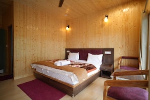 Habitación Deluxe | Camas extra y ropa de cama