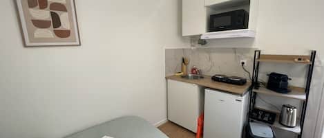1 bedroom, desk, iron/ironing board, travel crib